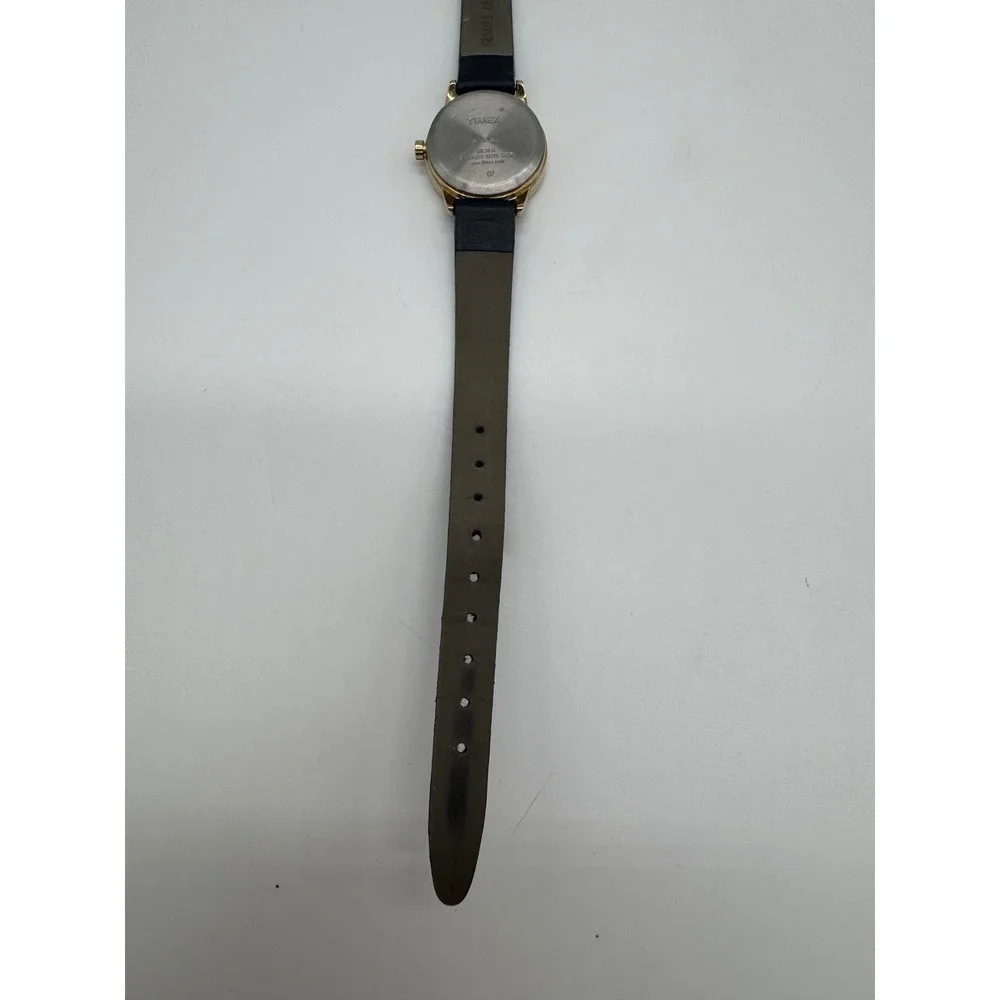 Timex Indiglo WR 30M Gold Tone White Dial Black Leather Watch CR 1216 needs bat